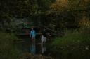 Kent and Jensen walking in the river